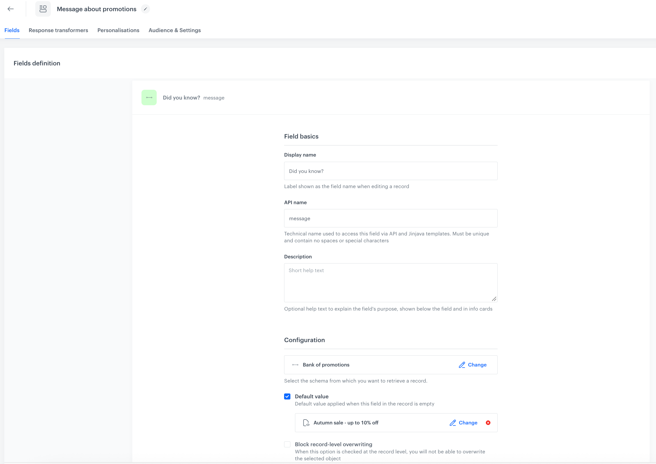 Configuration of the message field in the Message about promotions schema. The field references the Bank of promotions schema, and the Default value option is enabled with the Autumn sale - up to 10% off record selected